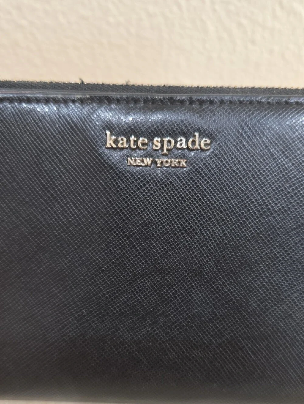 kate spade Black Zip-Around Saffiano Wallet with Pink Accent